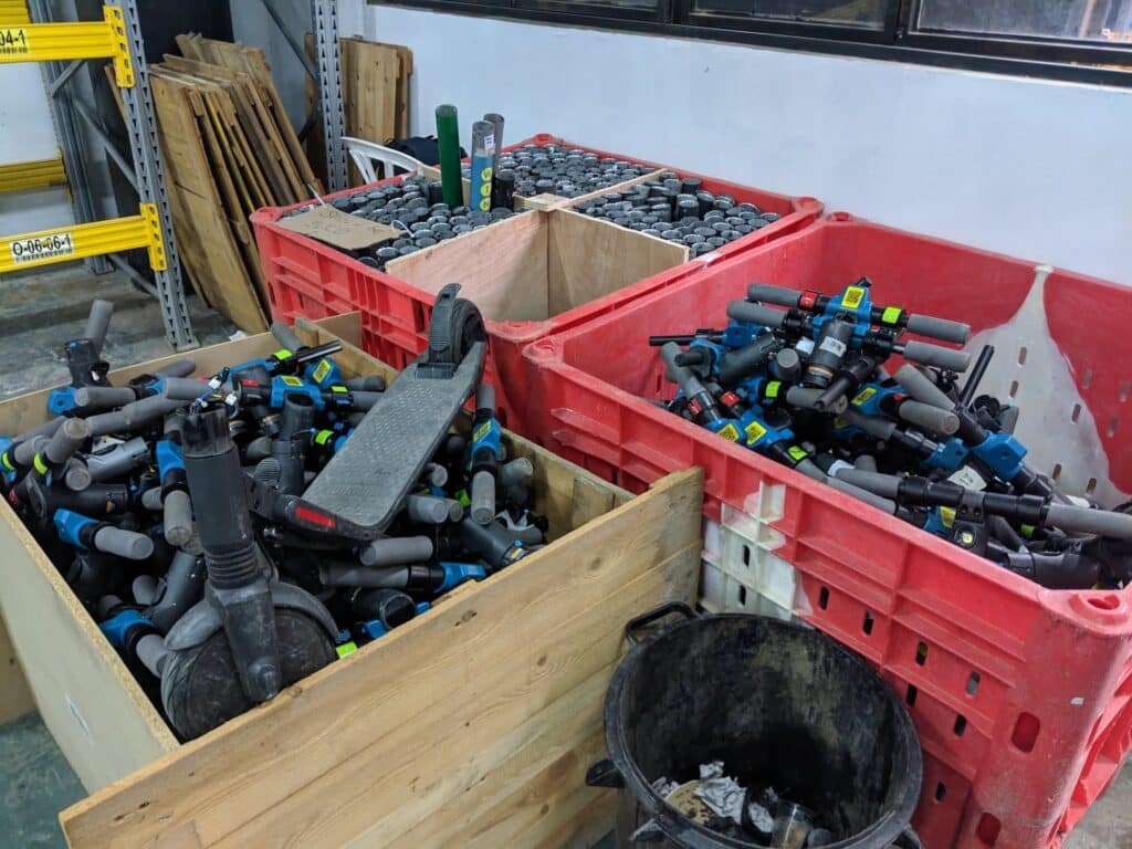 Lots of scooter parts in boxes at a scooter factory operations centre